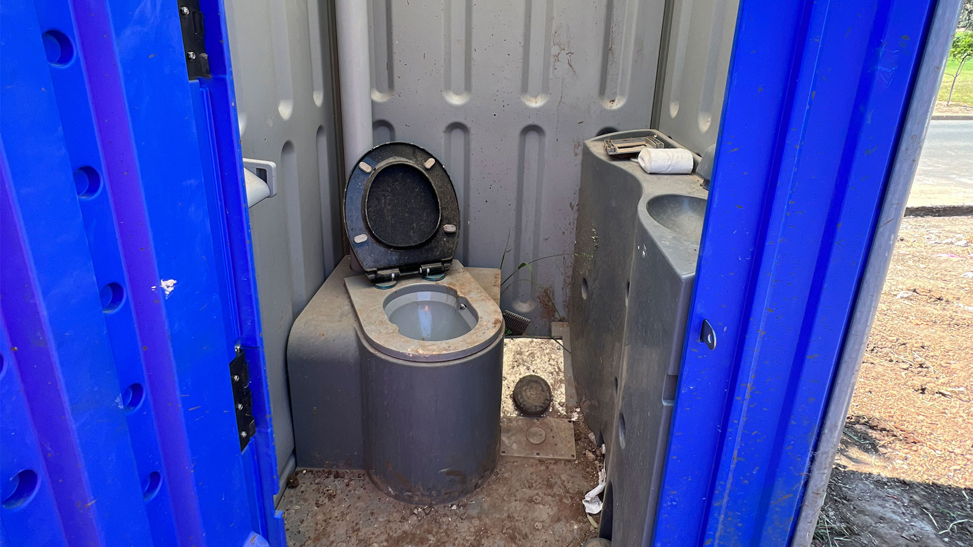 Picture of a construction site portaloo that didn't meet compliance. 