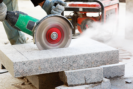 Cutting through concrete sheets generating silica dust