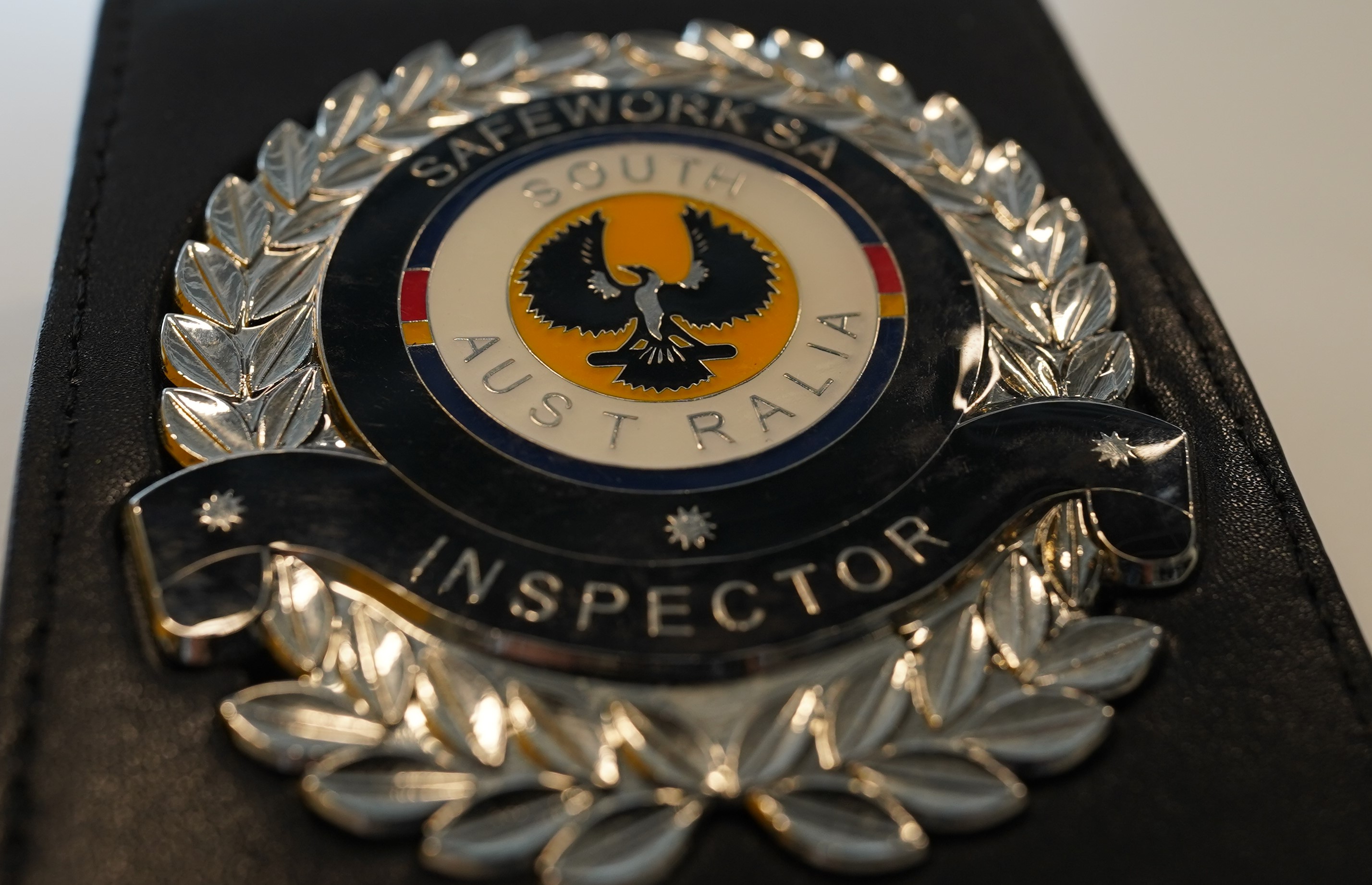 Close up of SafeWork SA Inspector identification badge